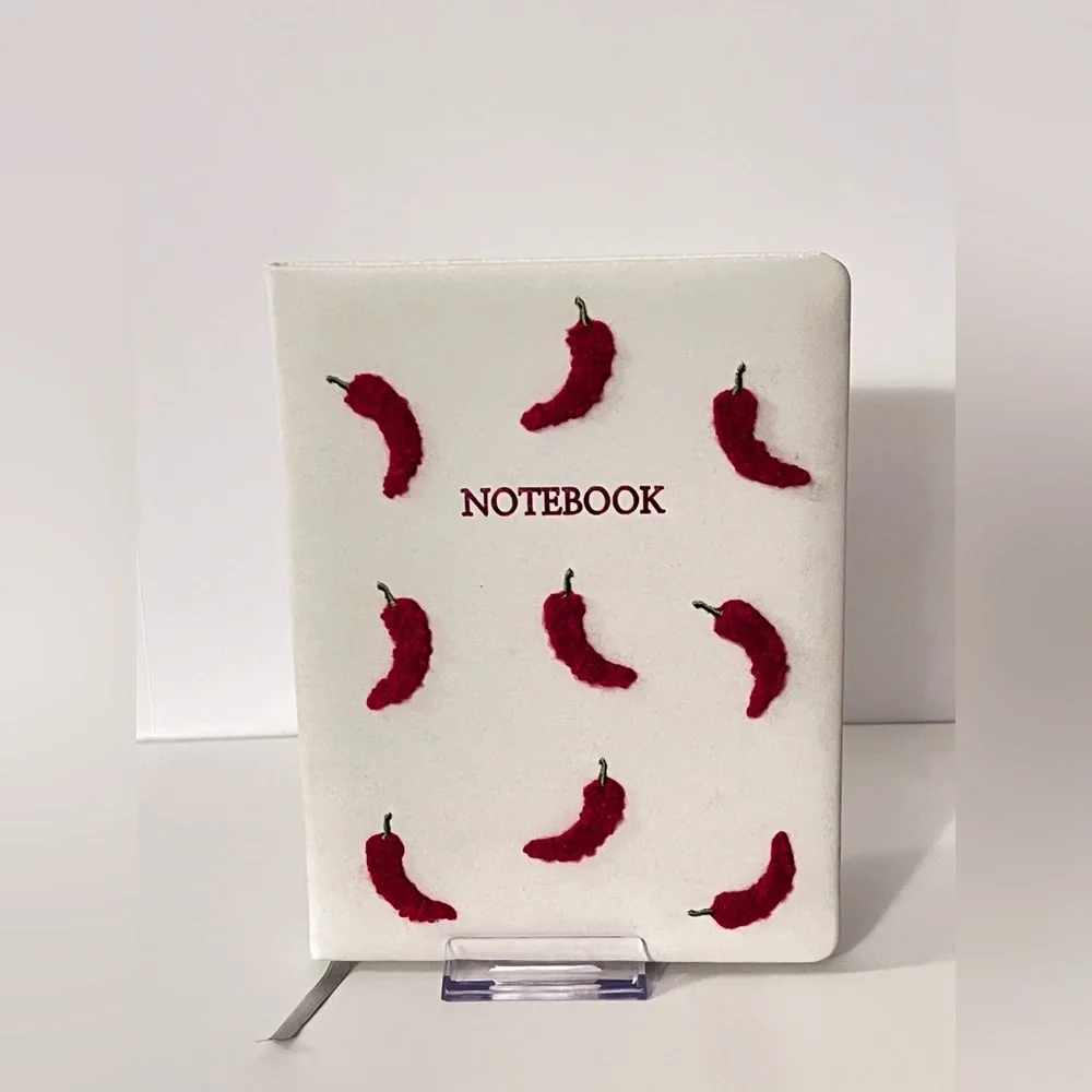 White Notebook with Red Chili Peppers